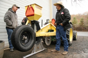 Growers check out the Verminator, a burrow-building implement that lays bait in burrows designed to reach gophers. (Melissa Hansen/Good Fruit Grower)
