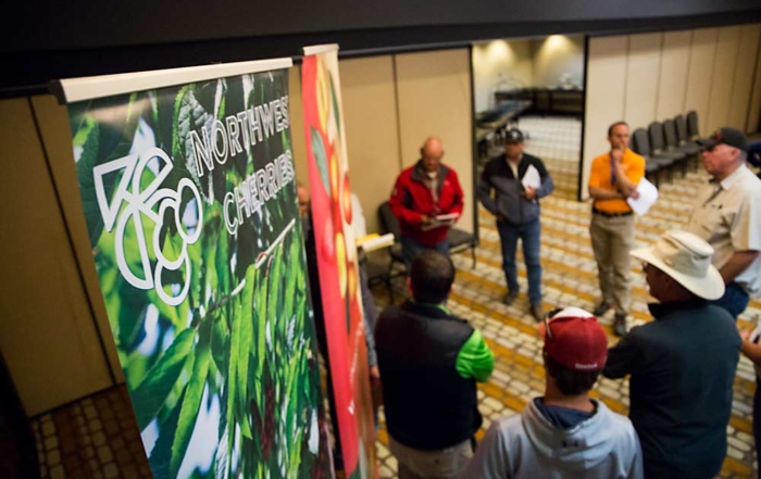 Southern Washington cherry growers huddle to discuss the upcoming crop today at the annual 5-state meeting of the Northwest Cherry Growers in Richland, Washington. (Ross Courtney/Good Fruit Grower)