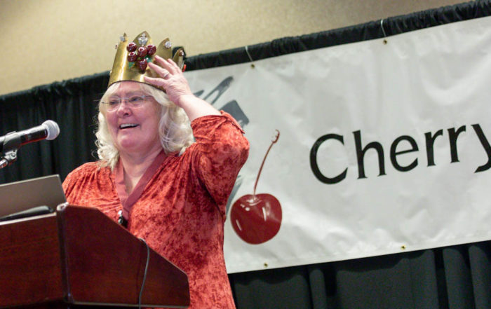 Dena Ybarra receives the Cherry King award on Jan. 10 at the annual Cherry Institute meeting in Yakima, Washington. (TJ Mullinax/Good Fruit Grower)