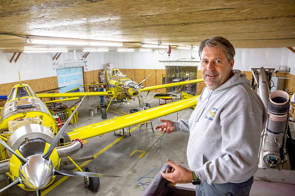 Winter is the time for plane maintenance in the shop of Mark Brown, owner of Quincy Flying Service of Quincy, Washington. Brown owns three planes, an Air Tractor 802, front, and a smaller Air Tractor 502. Not pictured is his Ag Cat, the largest of his three planes. (Ross Courtney/Good Fruit Grower)