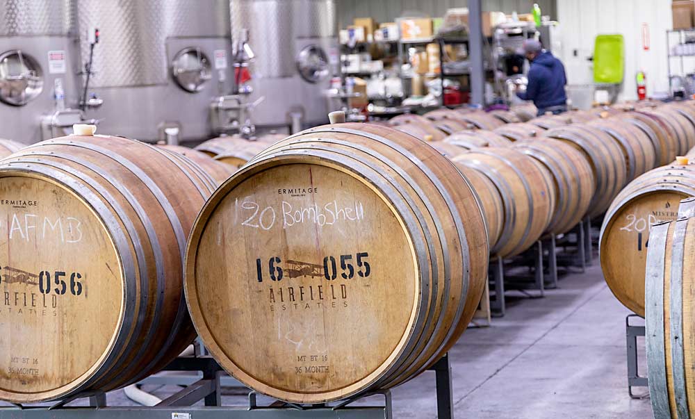 Inside Airfield’s winery in early October, the 2020 Bombshell red blend is being transferred to barrels to free up tank space for the incoming 2021 crop. A glass shortage has slowed bottling, making storage capacity even more critical, which is why the winery plans to continue expanding its barrel rooms, Miller said. (Kate Prengaman/Good Fruit Grower)