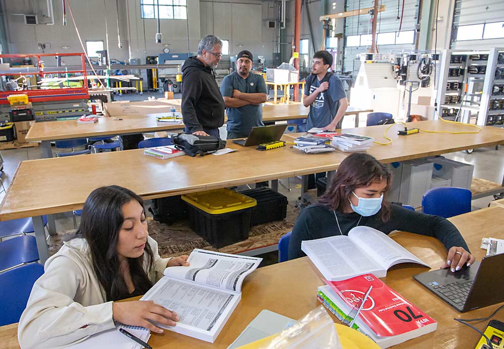 Alexandra Garcia, left, and fellow ag tech workforce students review for an exam in September in the workshop at Hartnell College in Salinas, California. The state’s community colleges, universities and produce employers are putting millions of dollars in grant funding toward preparing workers for agriculture’s technological progress. (Ross Courtney/Good Fruit Grower)