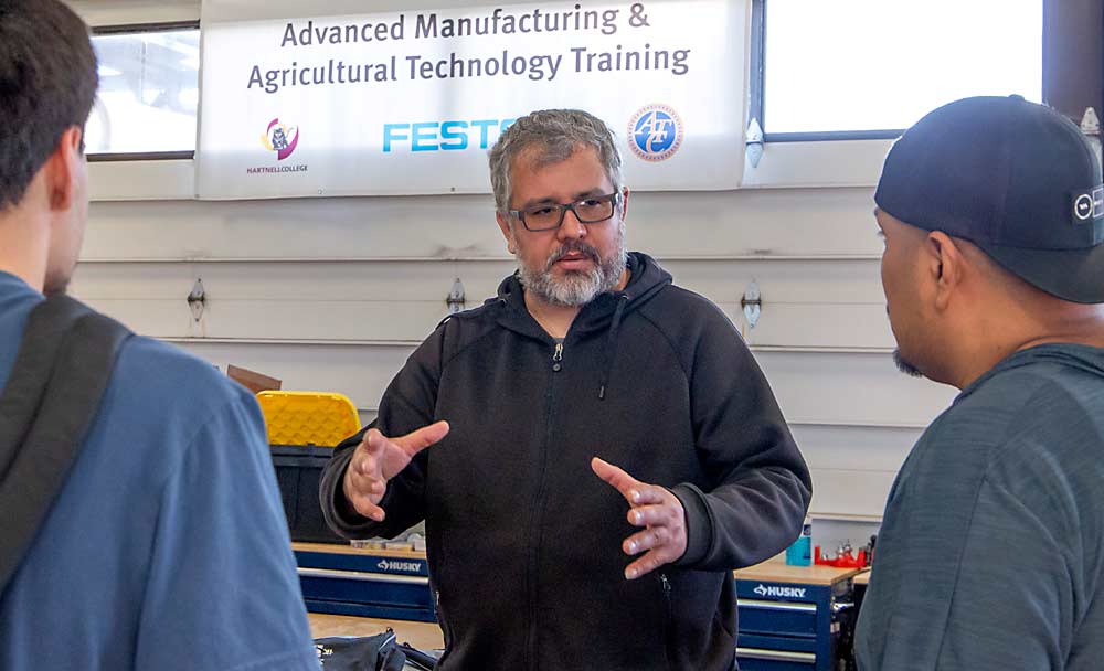 Jorge Magaña, now a paper mill employee, takes ag tech classes to better understand computer programming and electrical circuits so he can find work anywhere. Maybe a farm, he said. (Ross Courtney/Good Fruit Grower)