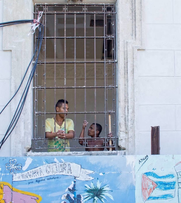 Two men taking a break from a construction job near Havana’s harbor. They watched tourists pass by on the streets below. (O. Casey Corr/Good Fruit Grower)