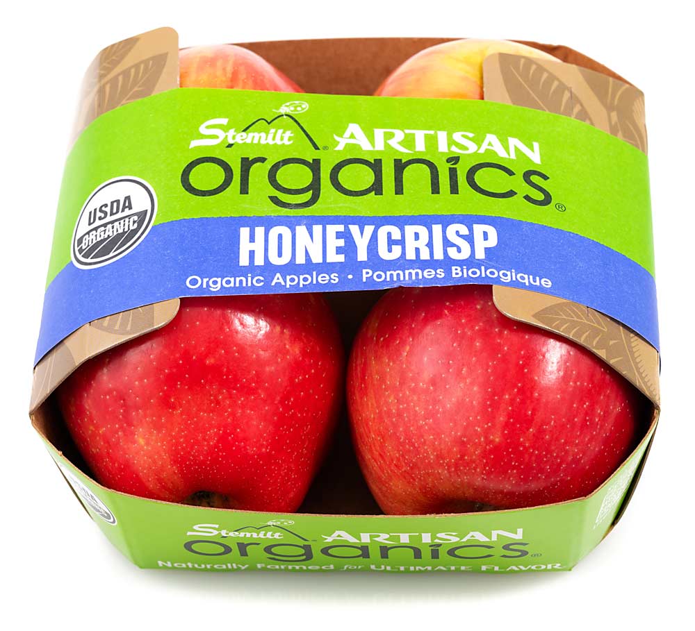Stemilt Growers of Wenatchee, Washington, ships some of its organic apples in a paperboard four-pack the company calls EZ Band. (Courtesy Stemilt Growers)