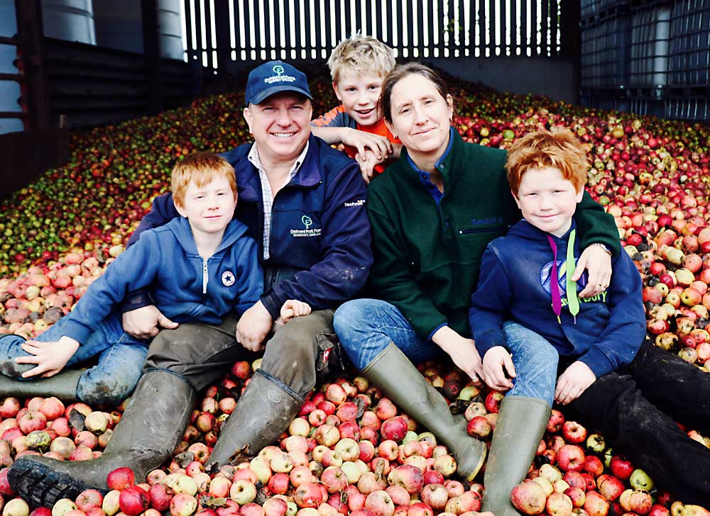 Neil Macdonald, pictured here with his family among a pile of cider apples, also attended a previous Great Lakes EXPO to present what he had learned over the year he spent as a Nuffield Scholar, which included traveling the United States and other parts of the world in 2014 to study the global cider industry. (Courtesy Neil Macdonald)
