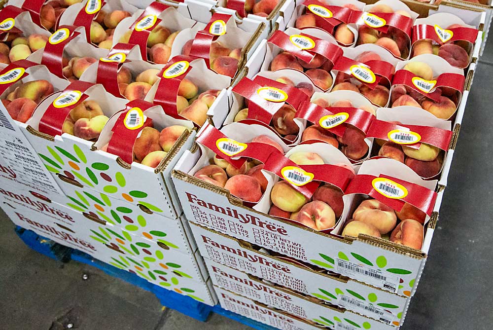 Peaches in paperboard packaging await shipment in 2021 at Family Tree Farms in Kingsburg, California. (Ross Courtney/Good Fruit Grower)