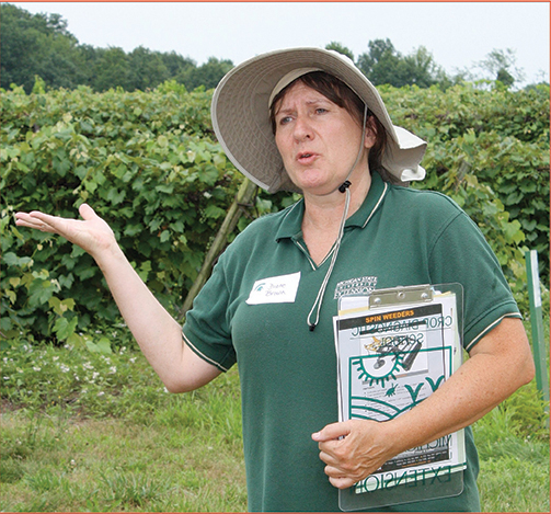 Diane Brown, the extension fruit educator in Berrien County, Michigan, is concerned that herbicide-tolerant field crops will threaten grapes and other fruit. Field crops and specialty crops coexist all along the Lake Michigan shore. Richard Lehnert