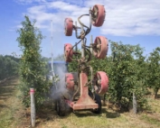 Cornell researchers show how attaching a series of ultrasound sensors to a sprayer provides information about gaps in the tree canopy and, by controlling the fan, reduces air speed. (Shannon Dininny/Good Fruit Grower)