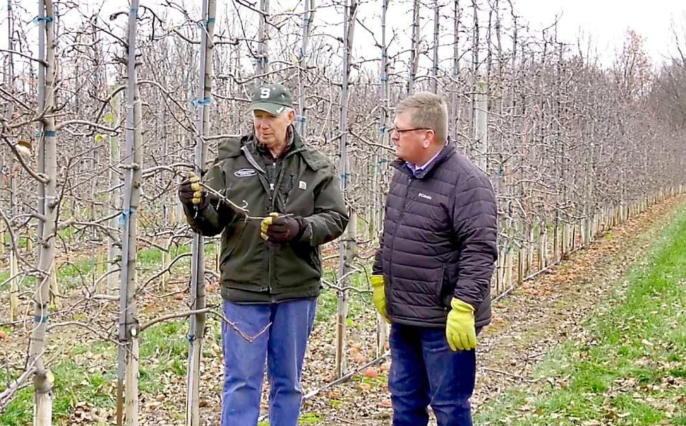 Phil Schwallier, left, interviews Chris Kropf from Hart Farm Orchards for the International Fruit Tree Association’s 64th annual conference, which was held virtually in February. Despite his retirement from MSU, Schwallier remains active in the industry. (Courtesy Steve Evans/IFTA)