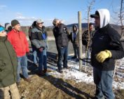 Pennsylvania grower Blake Slaybaugh, right, discusses pruning techniques and rootstocks with members of the International Fruit Tree Association during the group’s annual conference tour on Feb. 14 in Biglerville. (Matt Milkovich/Good Fruit Grower)