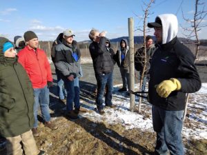 Pennsylvania grower Blake Slaybaugh, right, discusses pruning techniques and rootstocks with members of the International Fruit Tree Association during the group’s annual conference tour on Feb. 14 in Biglerville. (Matt Milkovich/Good Fruit Grower)