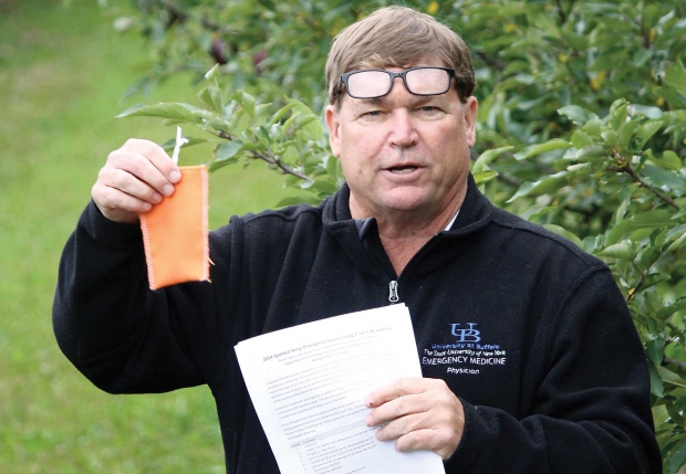 MSU entomologist Larry Gut holds the attract-and-kill lure Matt Grieshop, Juan Huang, and he developed. (Richard Lehnert/Good Fruit Grower)