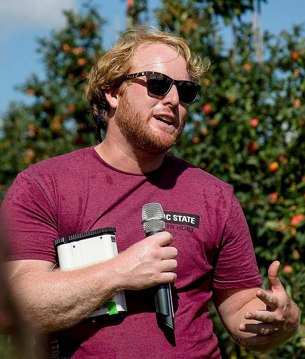 North Carolina State University postdoctoral research scholar Jimmy Larson led a research project using a handheld spectrometer to predict the results of thinning sprays. Initial results show greater than 90 percent accuracy within three days of spraying. (Courtesy Steve Schoof/North Carolina State University)