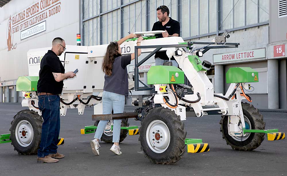 NAIO Technologies put one of its weeding robots on display in April at the Salinas Sports Complex in Salinas, California, at a press conference to generate interest in the FIRA USA event that brings farmers and tech companies together. Walt Duflock, vice president of innovation for Western Growers, which co-sponsors the event, is urging tree fruit growers to attend the September event. (Courtesy Richard Green Photography/ for Western Growers)