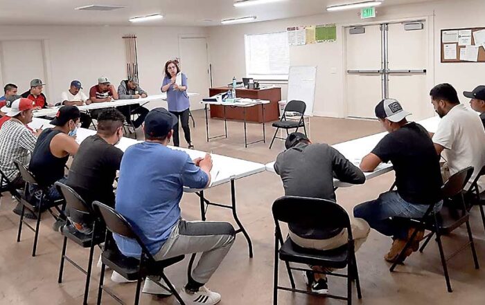 Outside the orchard, guest workers participate in English classes led by the Okanogan County Literacy Council at wafla’s Riverview Meadows farmworker housing. (Courtesy wafla)