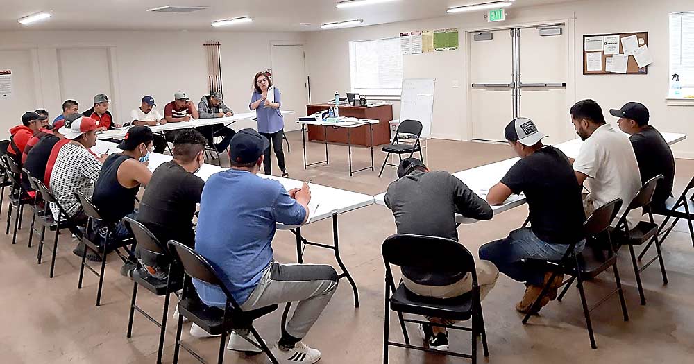 Outside the orchard, guest workers participate in English classes led by the Okanogan County Literacy Council at wafla’s Riverview Meadows farmworker housing. (Courtesy wafla)