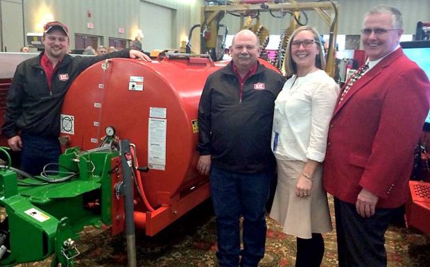 The first in-kind donation to under the Michigan Tree Fruit Commission is a sprayer from Gillison’s Variety Fabrication to the Northwest Michigan Horticulture Research Station. From left are Craig and Ron Gillison, Nikki Rothwell, station coordinator, and Mike VanAgtmael, fruit grower and Tree Fruit Commission board member. (Richard Lehnert/Good Fruit Grower)