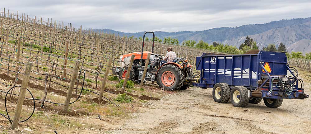 Annual compost application is one of the sustainable practices Rocky Pond Estate Winery adopted several years ago. This spring, the company certified its 160 acres of vineyards under the new Sustainable WA standard, which will help Rocky Pond sell grapes to customers who want to know more about where their wines come from, said director of viticulture Shane Collins. (Kate Prengaman/Good Fruit Grower)