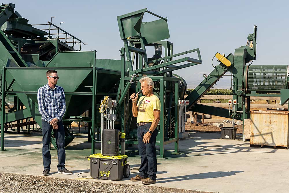 Canaday, right, and Parker Morris, talk about the hazelnut processing facility, Mount Adams Hazelnuts, now operating in Wapato. Processing capability is key to build the organic Eastern Washington hazelnut industry Canaday envisions. (Kate Prengaman/Good Fruit Grower)