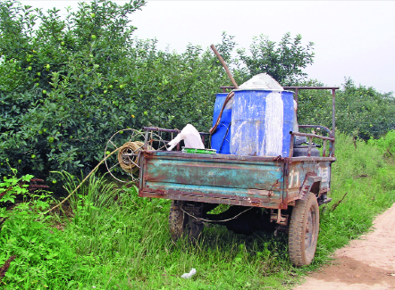 Orchard equipment is primitive in China. Orchards have no alleys, and sprayers such as this are parked in roads between the orchards and have a long hose that is used to spray the orchard tree by tree. Photo by Geraldine Warner