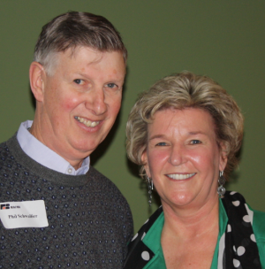 Dawn Drake congratulates Phil Schwallier after Michigan Processing Apple Growers gave him the distinguished service award. Schwallier, the Michigan State University extension fruit educator for west central Michigan, is an expert on apple thinners and plant growth regulators and current president of the International Tree Fruit Association. (Richard Lehnert/Good Fruit Grower)