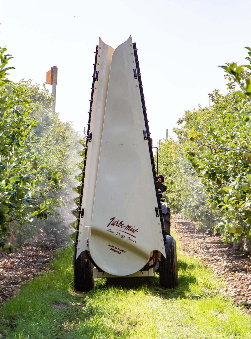 A smart sprayer demonstrates with water at the Smart Orchard field day. Computer imaging tells the sprayer when to open and close valves based on when it senses vegetation. (Ross Courtney/Good Fruit Grower)