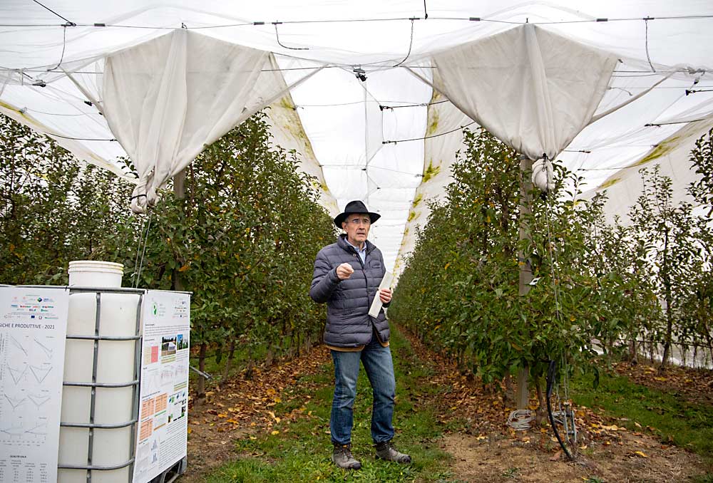 Researcher Luca Corelli Grappadelli at the University of Bologna discusses a netting trial that reduced water needs by half during the International Fruit Tree Association tour through Italy in November. (Ross Courtney/Good Fruit Grower)