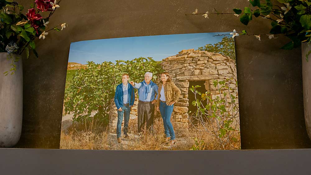 A family portrait of the siblings with their father and advisor, Jesús Sr., near the family’s Bodegas Valdemar in La Rioja, Spain, hangs in the Walla Walla tasting room. (Ross Courtney/Good Fruit Grower)