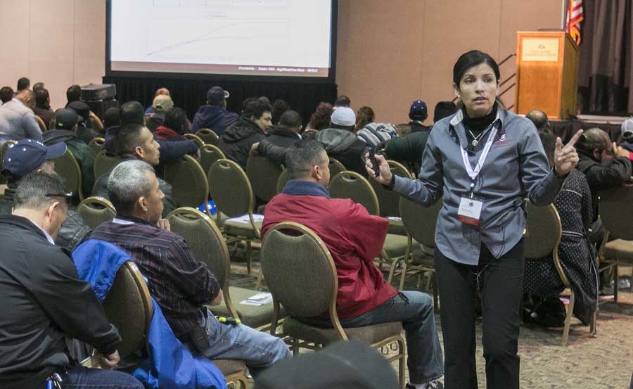 Melba Salazar-Gutierrez of Washington State University speaks about practical use of AgWeatherNet in orchards during one of the Spanish speaking sessions at the annual meeting of the Washington State Tree Fruit Association. (TJ Mullinax/Good Fruit Grower)