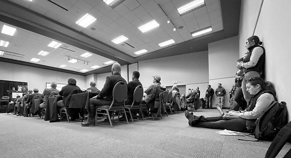 It’s standing- (and sitting in the rows) room-only for the WSU viticulture talk on day 2 of the 2020 Washington Winegrowers' annual meeting in Kennewick. (TJ Mullinax/Good Fruit Grower)