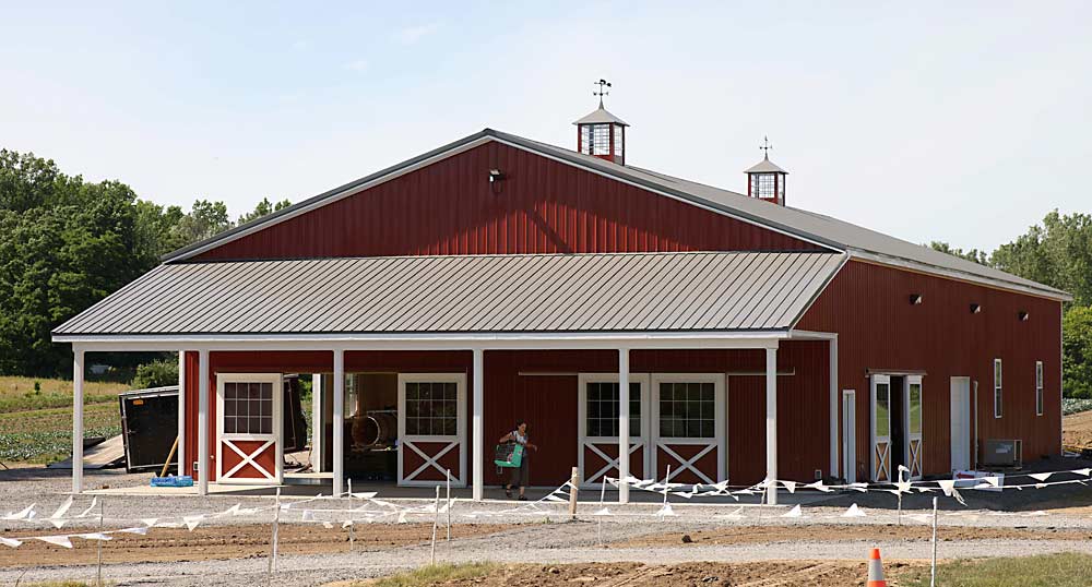Wickham Farms in Penfield, New York, built a new barn last year to support their expanded CSA business. Half of it is used for the distribution of CSA produce, the other half for equipment repair. (Courtesy Debbie Wickham)