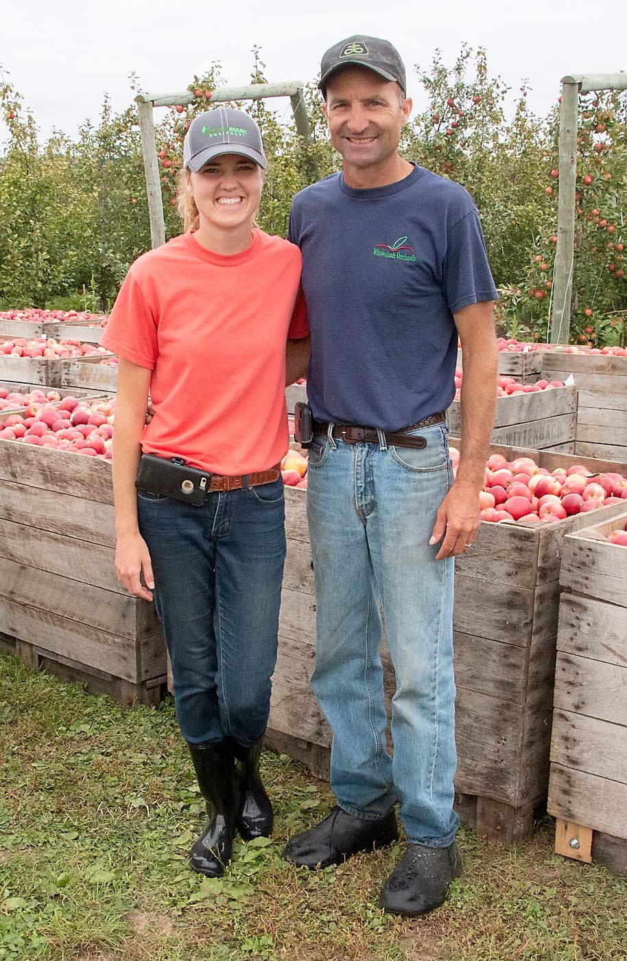 Elizabeth Wittenbach, left, and her father, Mike Wittenbach, supervised the picking of Buckeye Galas during September’s harvest in Belding, Michigan. (Matt Milkovich/Good Fruit Grower)