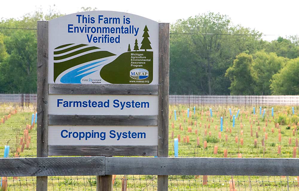 When a Michigan farm is verified by the Michigan Agriculture Environmental Assurance Program, it can put up a sign announcing its status, like the one seen here at Youngblood Vineyard. Program verifier Dan Busby will talk about the program during a Great Lakes EXPO session focused on climate change and sustainability. (Matt Milkovich/Good Fruit Grower)