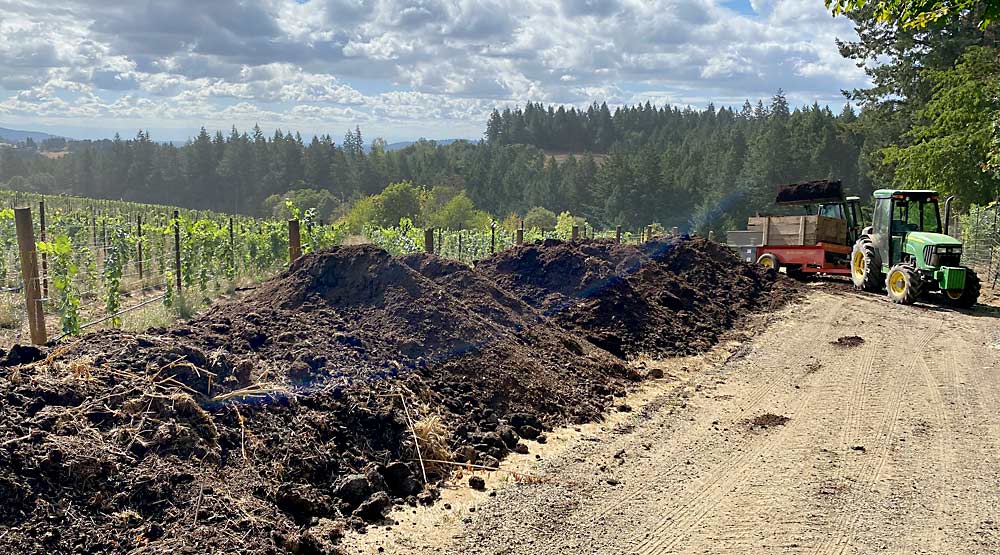 Adelsheim spreads compost in areas of shallow soil or low organic matter, to help build soil structure and improve both soil and vine health. The winery layers their grape pomace with organic matter from the vineyard’s landscaping and gardens, and they add organic manure from neighboring farms. “It’s breaking down into this gorgeous black gold that’s just the most incredible soil you could ever want to buy — and we’re making it,” Gregory said. (Courtesy Kelli Gregory/Adelsheim Vineyard)