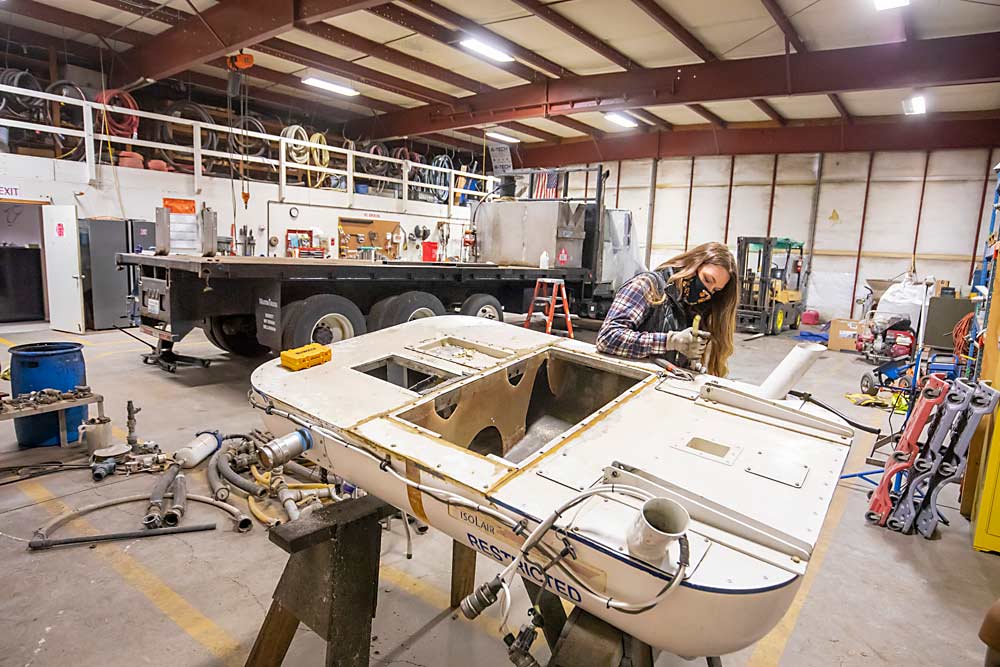 Schmidt replaces a corroded sight tube on a helicopter spray tank in the company’s Zillah hangar. Winter is typically a time for maintenance for agricultural aviators, before spring spray work begins in Northwest orchards. (TJ Mullinax/Good Fruit Grower)