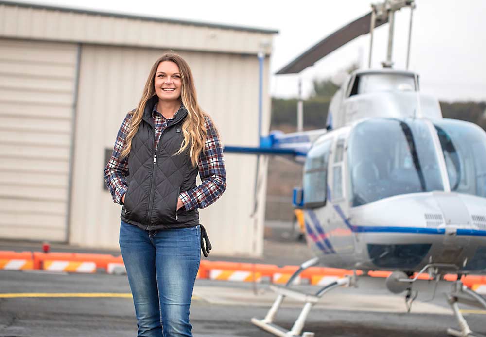 Helicopters do more for the fruit industry than just dry cherries, said Samantha Schmidt, the Yakima branch manager for North Wind Aviation. She can apply all the same products fixed-wing applicators do. (TJ Mullinax/Good Fruit Grower)