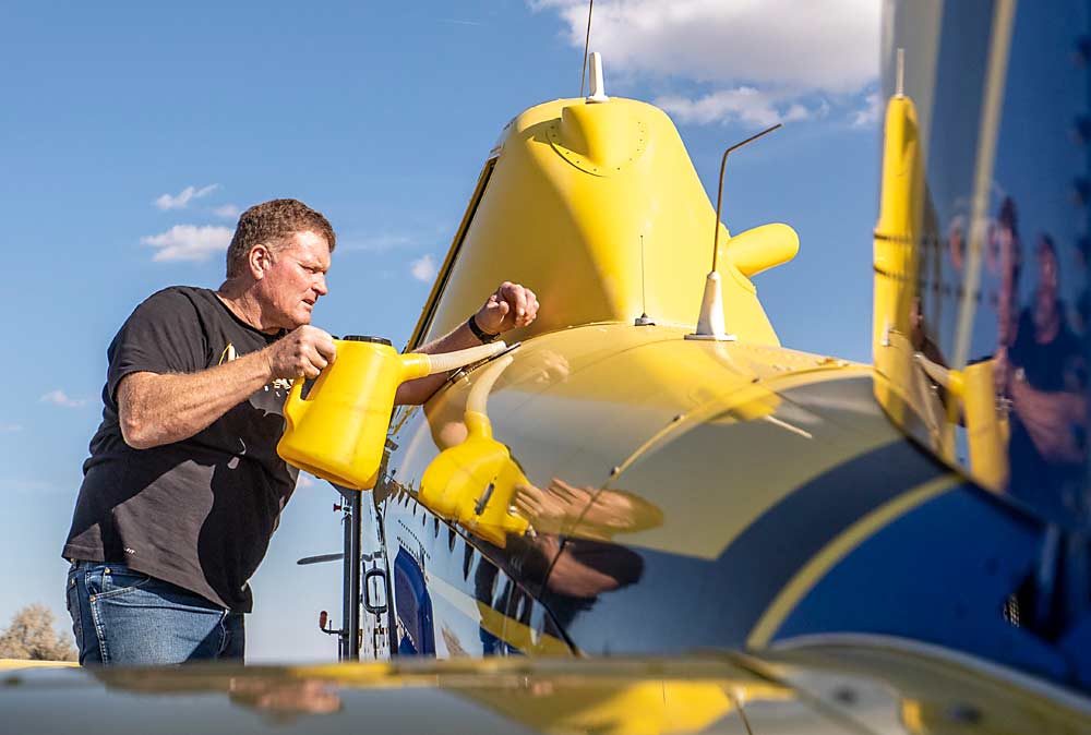 Beierle, the owner of a Royal City-based agriculture service in Washington, prepares his Air Tractor for a stop-drop application. (TJ Mullinax/Good Fruit Grower)
