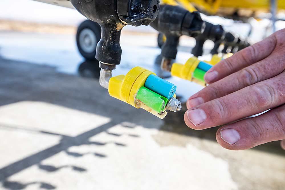 Pilots and growers say technology in plane nozzles, valves and flow regulators has improved enough to make aerial application precise to within inches. (TJ Mullinax/Good Fruit Grower)
