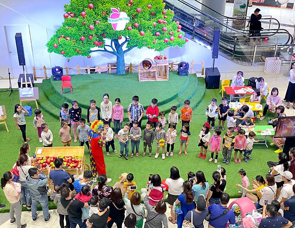 A clown, cooking demonstrations, video games and, of course, apples mark a “launching event” held by the Washington Apple Commission — and funded by Agriculture Trade Promotion dollars — in November at Aeon Long Bien Mall, one of the largest in Hanoi, Vietnam. (Courtesy Washington Apple Commission)