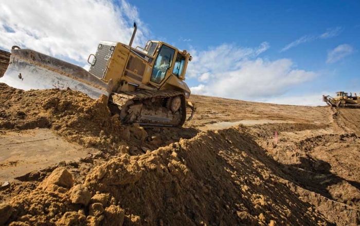 Stan Klabenes operates a large bulldozer on March 3, 2016, across the slope of a new cooling and frost control pond at a future orchard owned by Washington Fruit and Produce Co. near Kittitas, Washington. Klabenes works for Selland Construction, Inc., based in Wenatchee.(TJ Mullinax/Good Fruit Grower)