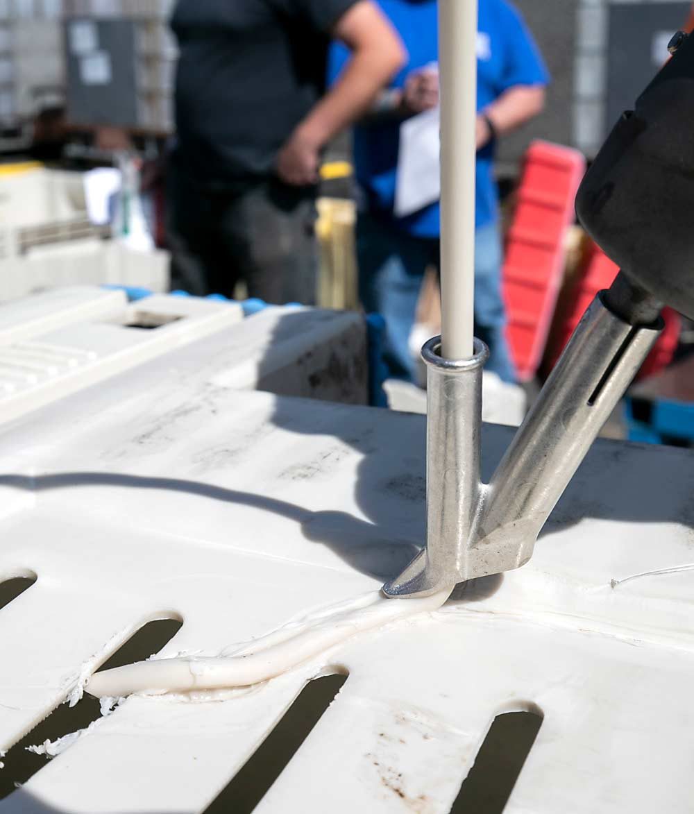 Hot-air welding, similar to using a hot-glue gun, takes patience when applying the plastic welding rods. (TJ Mullinax/Good Fruit Grower)