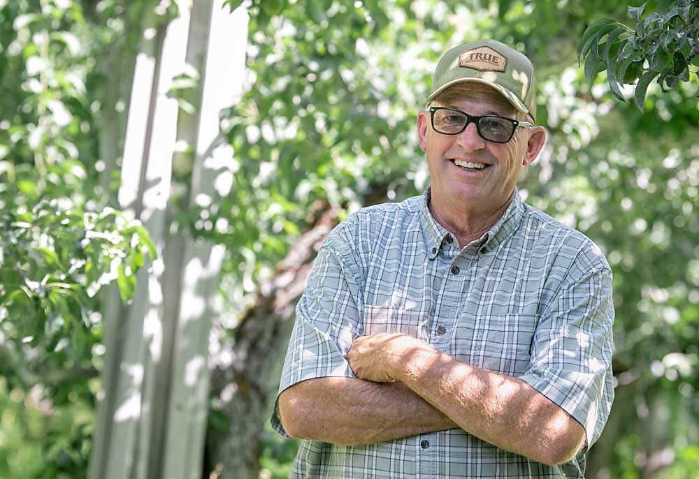 Neighbor Troy Davis acts as a pest assessor and mentor to the new farmers.  (TJ Mullinax/Good Fruit Producer)