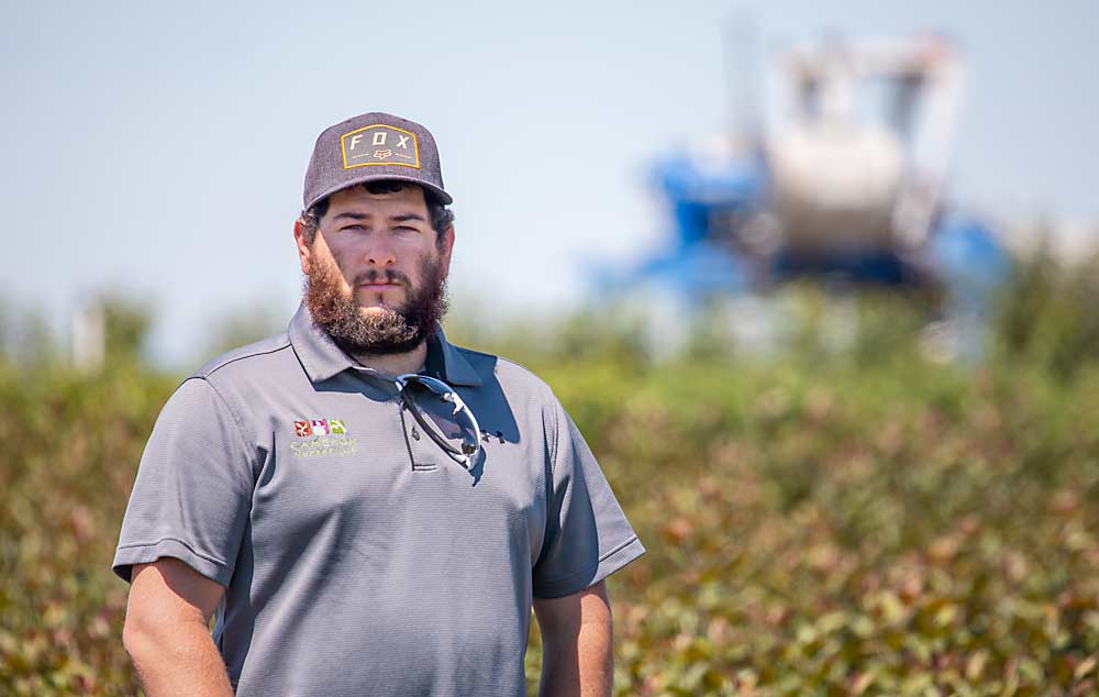 Eric Cameron, the manager of operations at Cameron Nursery, stands in one of the company’s nursery beds in Eltopia in June. (TJ Mullinax/Good Fruit Grower)
