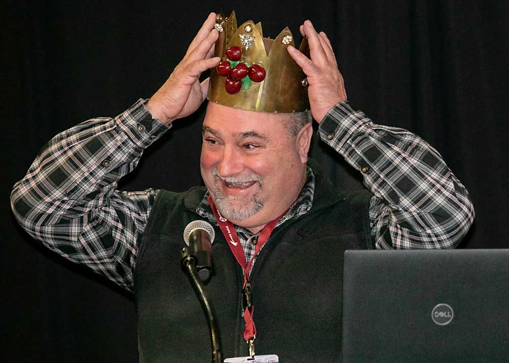 Pat Sullivan dons the crown as the 78th Cherry King at the luncheon Friday of the annual Cherry Institute, hosted by the Northwest Cherry Growers, in Yakima, Washington. (TJ Mullinax/Good Fruit Grower)