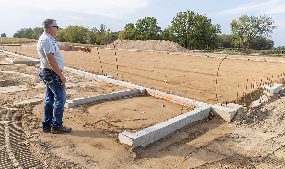 Dan Nitz stands next to the concrete foundation that will become Chill Hill’s new tasting room and winemaking facility near Baroda. The 12,800-square-foot facility will probably be finished in late 2024. (Matt Milkovich/Good Fruit Grower)
