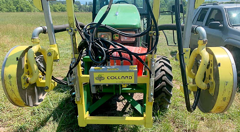 Former MSU graduate student Josh Vander Weide studied the Collard Early Leaf Remover as part of his doctoral research. He found that machine removal of leaves improved fruit quality more than hand removal, which is not usually the case in vineyard work. (Courtesy Josh Vander Weide/Michigan State University)