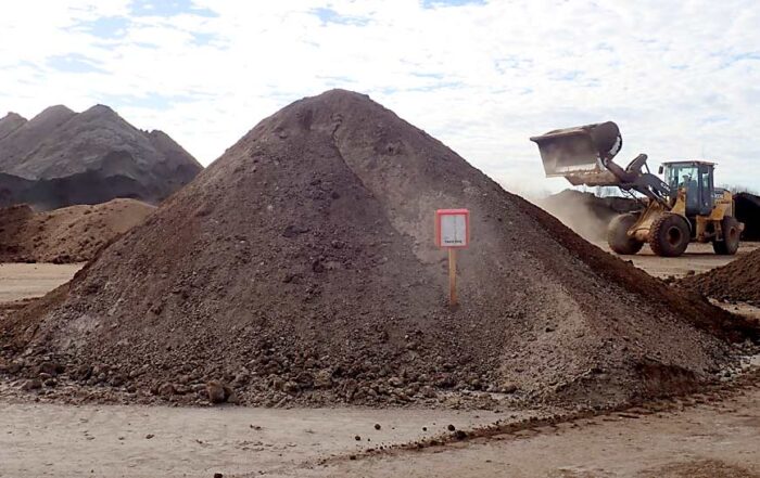 Loaders, dump trucks and conveyors at Morgan Composting Inc. in Sears, Michigan, are in constant motion converting piles of fresh manure into compost. The company is especially well-known for its Dairy Doo brand. (Leslie Mertz/for Good Fruit Grower)