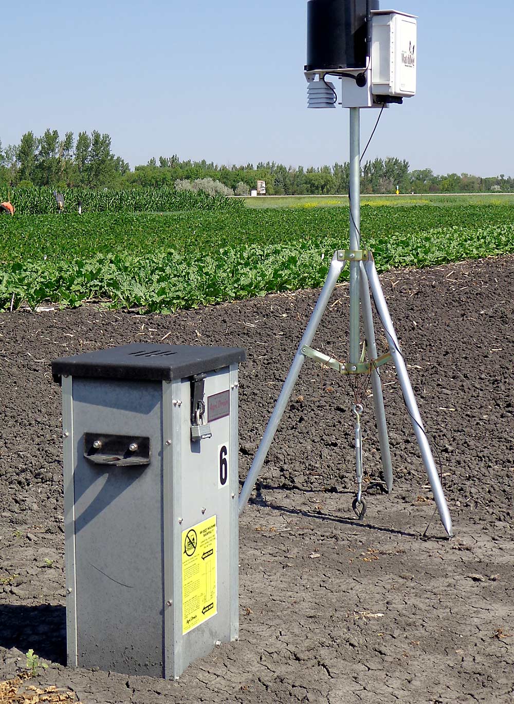 Extension agronomist Hans Kandel of North Dakota State University recommends control boxes, shown here in the foreground, as good additions to a drainage system. By adjusting the interior baffles, the grower can “drain when you need to, and hold some water when you don’t,” Kandel said. (Courtesy Hans Kandel/ North Dakota State University)