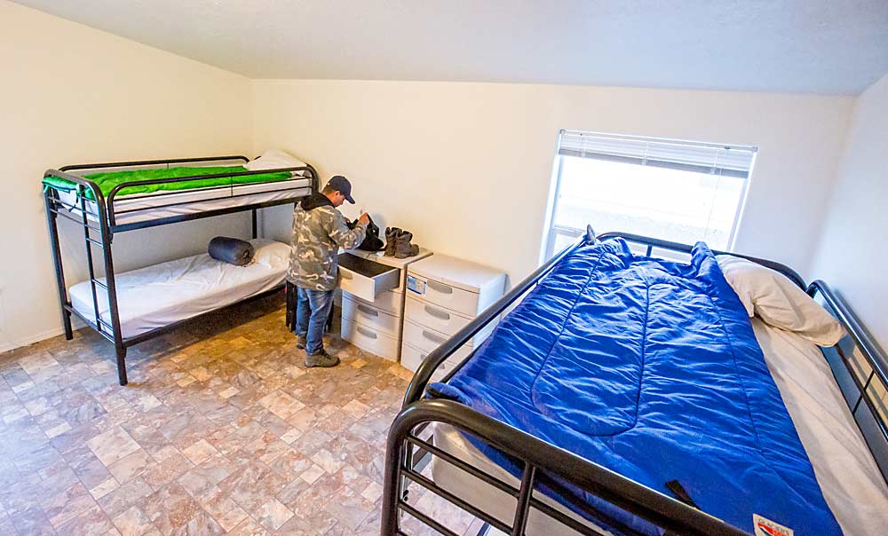 Providing ample space, as shown in this 2015 photo, in housing units for agricultural workers is one of several challenges farms face when reducing the risk of potentially spreading the coronavirus. Recommendations include arranging beds 6 feet apart, setting aside quarantine areas for sick workers and disinfecting surfaces daily. (TJ Mullinax/Good Fruit Grower)